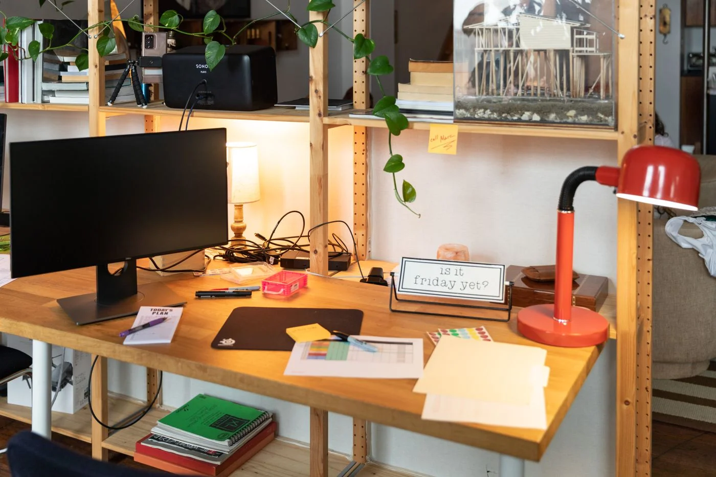 Desk with monitor and red task lamp