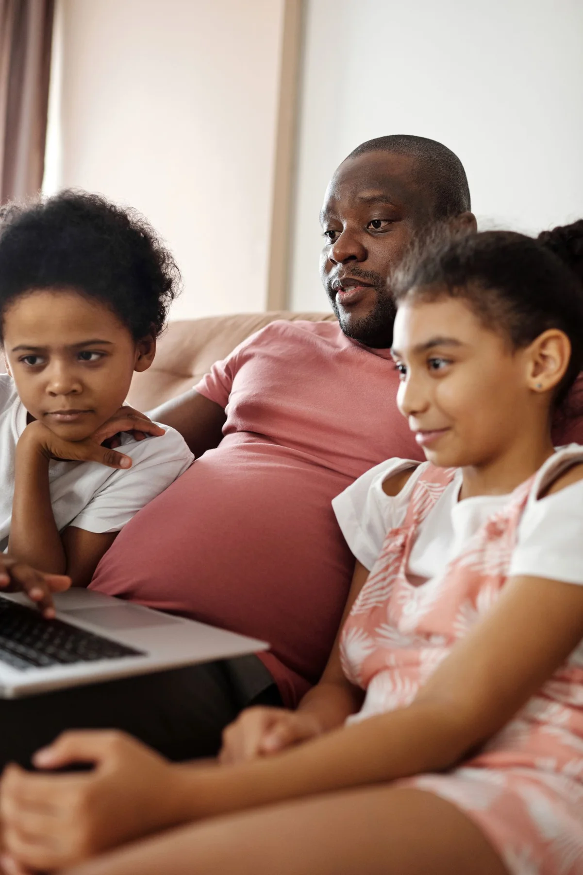 Family looking at a laptop together