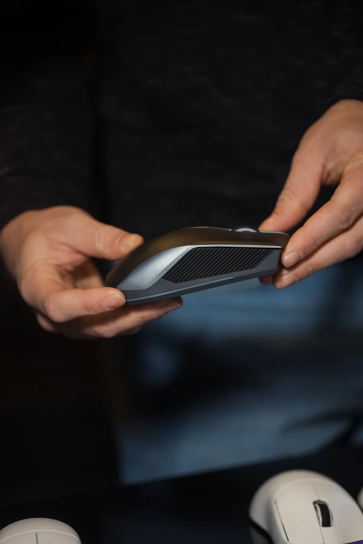 Hands holding a computer mouse