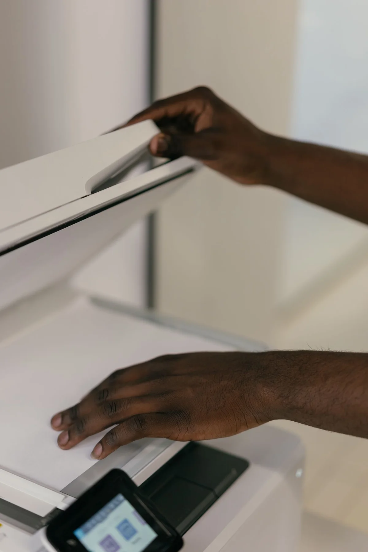 A sheet being positioned on a scanner