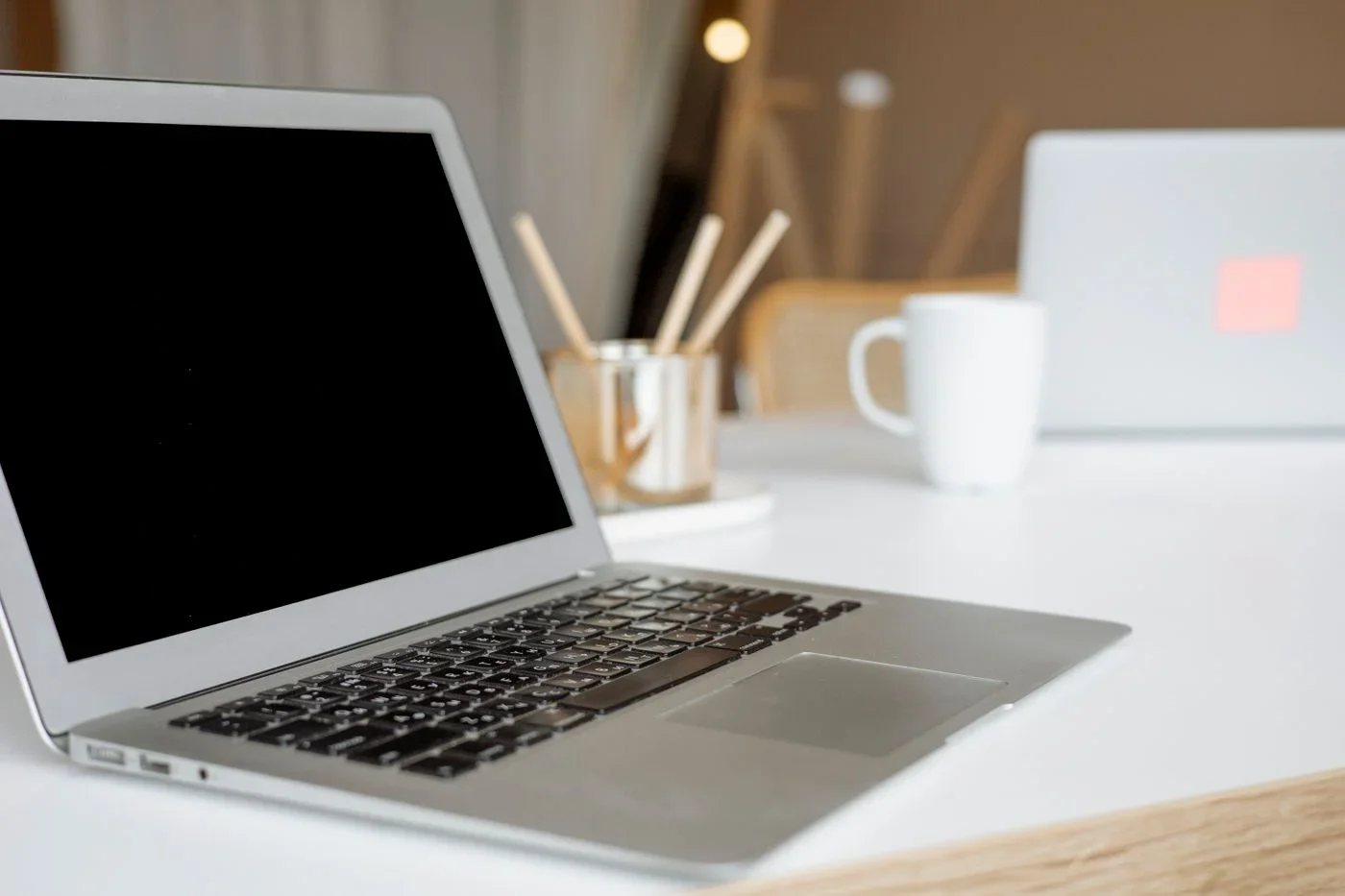 Open laptop on a light desk