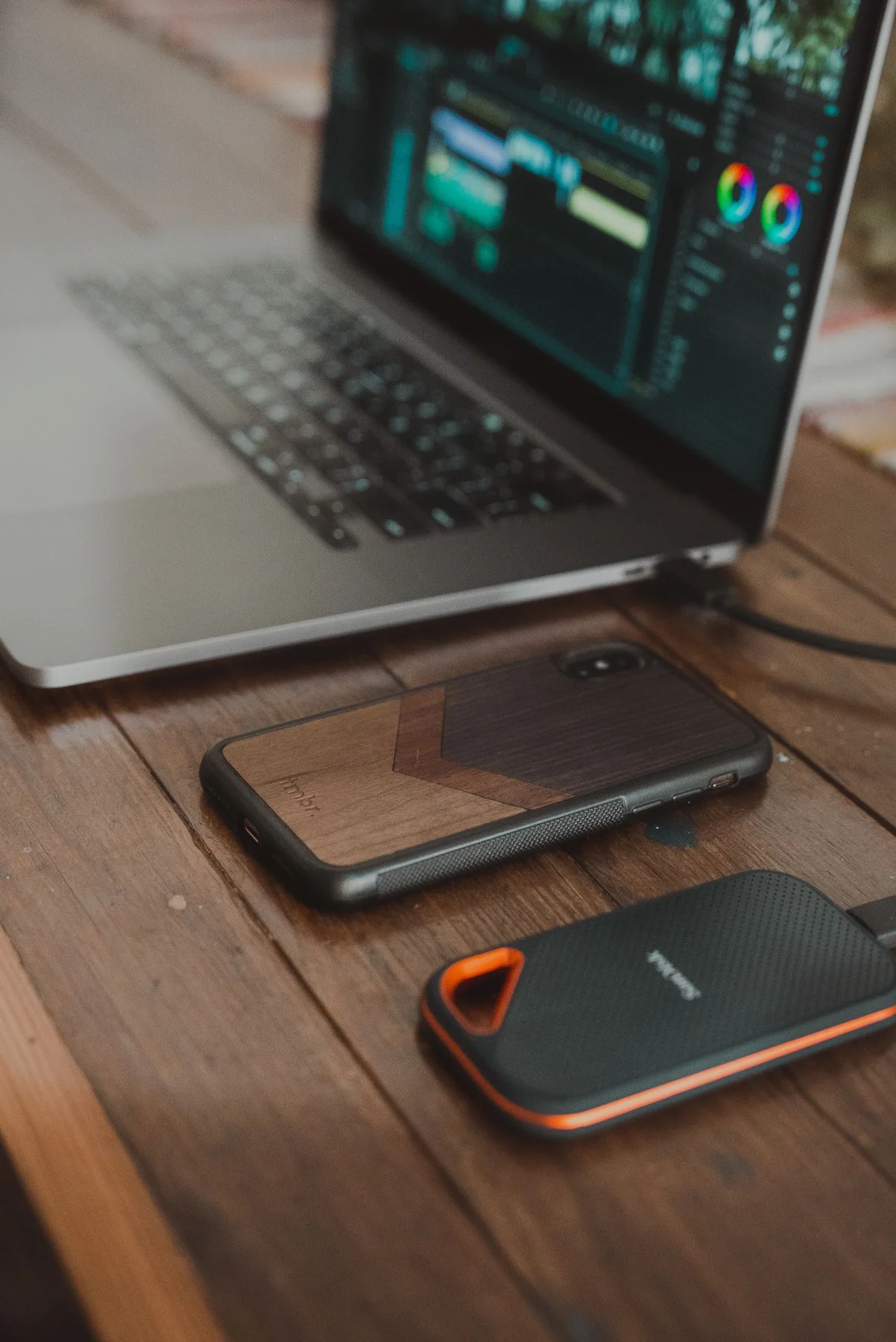 Laptop, smartphone and portable drive on a table