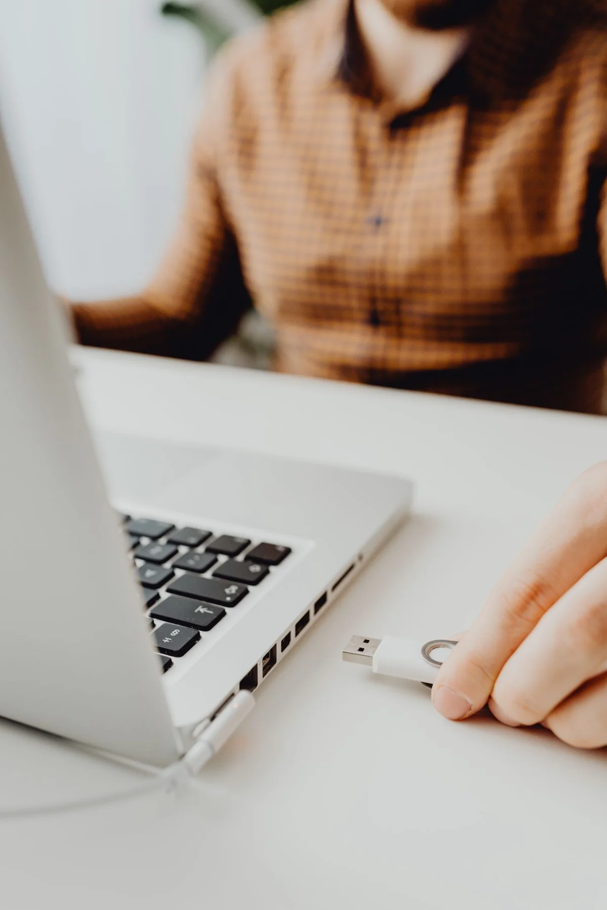 USB drive being connected to a laptop