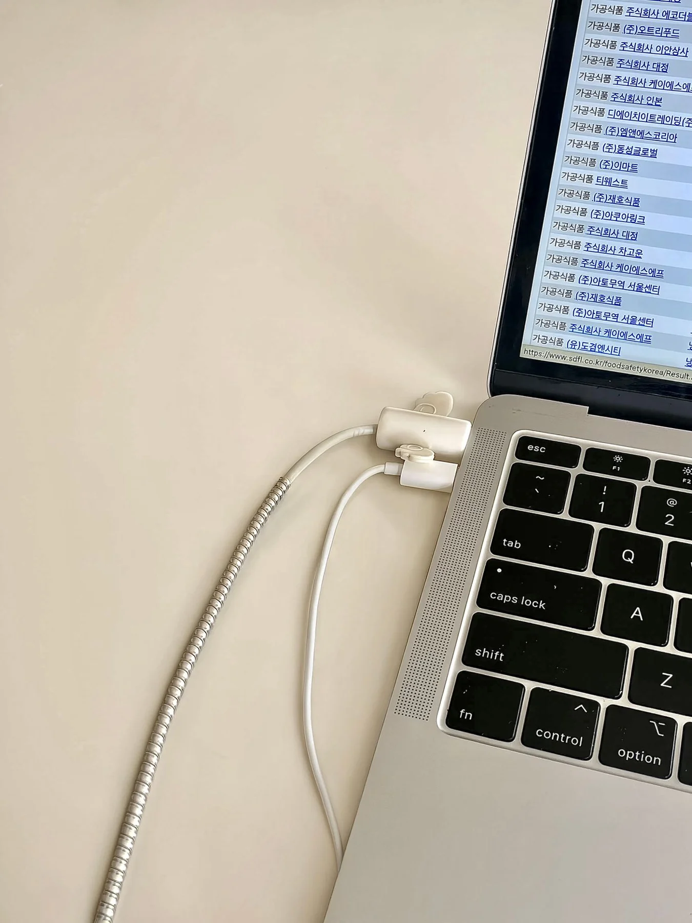Charging cables connected to a laptop